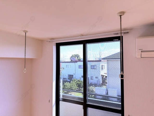 室内物干し竿かけ