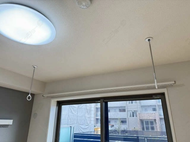 室内物干し竿かけ